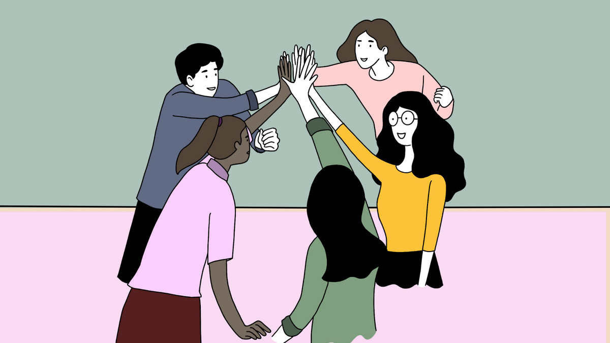 A team of 4 women and one man high fiving each other