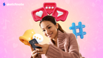 A woman looking into her phone with a hashtag, notification icon, heart icon, typing and send icons float above her head